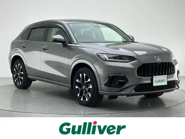 ホンダ ＺＲ－Ｖ ハイブリッド e:HEV Z 兵庫県 2024(令6)年 0.8万km スーパープラチナグレーメタリック 純正メモリナビ(Bluetooth/フルセグ/USB/applecarplay/androidauto)/パワーシート(D+N席)/シートヒーター(D+N席)/メモリーシート/ステアリングヒーター/BOSEサウンド/パワーバックドア/追従型クルーズコントロール/電子パーキングブレーキ/ブレーキホールド/前後ドライブレコーダー/ビルトインETC2.0/純正18インチアルミホイール/純正フロアマット/置くだけ充電/ブラインドスポットモニター/オートライト/オートマチックハイビーム/LEDヘッドライト/LEDフォグライト