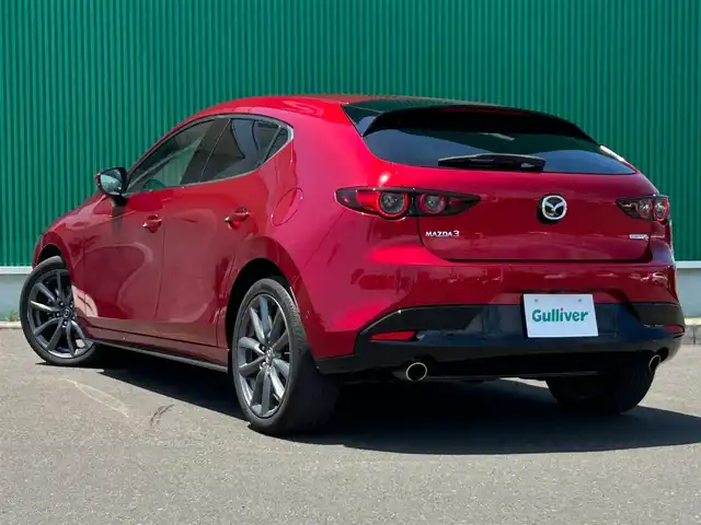 マツダ マツダ３ファストバック XD バーガンディセレクション 宮城県 2020(令2)年 3.5万km ソウルレッドクリスタルM スマートブレーキサポート/AT誤発進抑制制御/全車速追従機能付レーダークルーズコントロール/クルージングトラフィックサポート/車線逸脱警報システム/レーンキープアシスト/前後側方接近車両検知/ブラインドスポットモニタリング/交通標識認識システム/パーキングセンサー/ドライバーアテンションアラート/ヘッドアップディスプレイ/マツダコネクト8.8インチセンターディスプレイ/・CD/DVD/・Bluetooth/・フルセグTV/・USB/HDMI/バックカメラ/ビルトインETC/レッドパーフォレーション革シート/運転席メモリー機能付パワーシート/前席シートヒーター/革巻きステアリング/ステアリングヒーター/ステアリングスイッチ/パドルシフト/アダプティブLEDヘッドランプ/オートライト/スマートキー＆プッシュスタート/スペアキー1本/電動パーキングブレーキ/ブレーキホールド/電動格納ミラー/純正18インチAW/純正フロアマット/トノカバー/W/サイド/カーテンエアバッグ