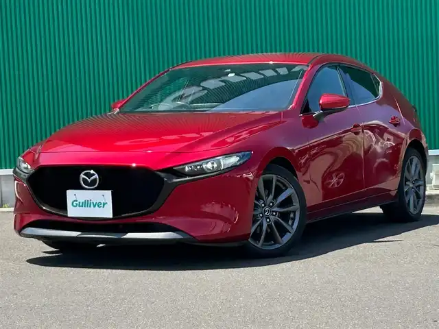 マツダ マツダ３ファストバック XD バーガンディセレクション 宮城県 2020(令2)年 3.5万km ソウルレッドクリスタルM スマートブレーキサポート/AT誤発進抑制制御/全車速追従機能付レーダークルーズコントロール/クルージングトラフィックサポート/車線逸脱警報システム/レーンキープアシスト/前後側方接近車両検知/ブラインドスポットモニタリング/交通標識認識システム/パーキングセンサー/ドライバーアテンションアラート/ヘッドアップディスプレイ/マツダコネクト8.8インチセンターディスプレイ/・CD/DVD/・Bluetooth/・フルセグTV/・USB/HDMI/バックカメラ/ビルトインETC/レッドパーフォレーション革シート/運転席メモリー機能付パワーシート/前席シートヒーター/革巻きステアリング/ステアリングヒーター/ステアリングスイッチ/パドルシフト/アダプティブLEDヘッドランプ/オートライト/スマートキー＆プッシュスタート/スペアキー1本/電動パーキングブレーキ/ブレーキホールド/電動格納ミラー/純正18インチAW/純正フロアマット/トノカバー/W/サイド/カーテンエアバッグ