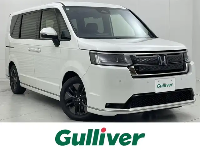 ホンダ ステップワゴン スパーダ eHEV 茨城県 2025(令7)年 0.1千km プラチナホワイトパール 11.4インチナビHonda CONNECTナビ /Bluetooth/フルセグ/CD/DVD/ラジオ/バックカメラ/レーダークルーズコントロール/両側パワースライドドア/路外逸脱抑制機能/クリアランスソナー/衝突被害軽減ブレーキ/シートヒーター/オットマン/LEDヘッドライト/オートライト