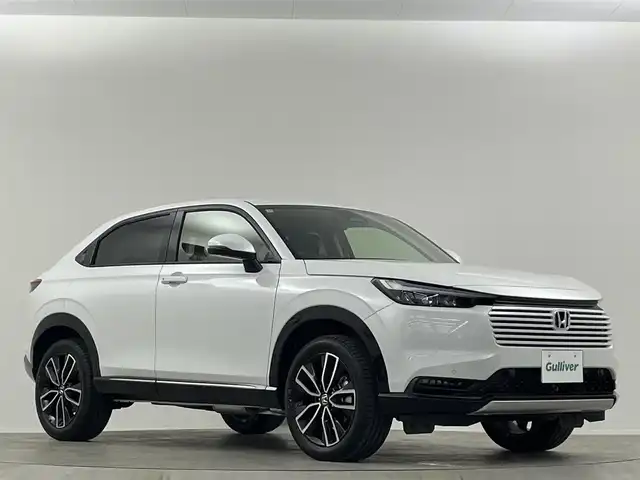 ホンダ ヴェゼル ハイブリッド e:HEV Z 埼玉県 2025(令7)年 0.1千km プラチナホワイトパール 登録済未使用車　純正９型ＤＡ　ＴＶ　ＢＴ　ＥＴＣ２．０　ＢＳＭ　バックカメラ　置くだけ充電　電動リアゲート　シートヒーター　ハーフレザーシート　ダウンヒルアシストコントロール　ハンドルヒーター