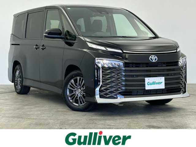 トヨタ ヴォクシー ハイブリッド S－G 群馬県 2024(令6)年 1.5万km アティチュードブラックマイカ フリップダウンモニター　純正１０．５ディスプレイオーディオ　バックカメラ　片側パワースライドドア　ＬＥＤ　純正１６インチＡＷ　ステアリングリモコン　ドライブレコーダー　スマートキー　ＥＴＣ　禁煙車