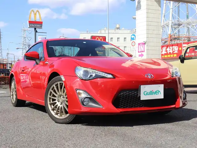 トヨタ ８６ GT リミテッド 神奈川県 2014(平26)年 9万km ライトニングレッド HKSマフラー/社外ステアリング MOMO/純正ナビ NSZT-W62G/：バックカメラ/：フルセグTV/スペアスマートキー/純正１７インチアルミホイール/革／アルカンターラコンビシート/：シートヒーター/アルミペダル／ステンレス製スカッフプレート/LEDクリアランス付きHIDヘッドライト/：オートヘッドライト/純正フロアマット/ETC