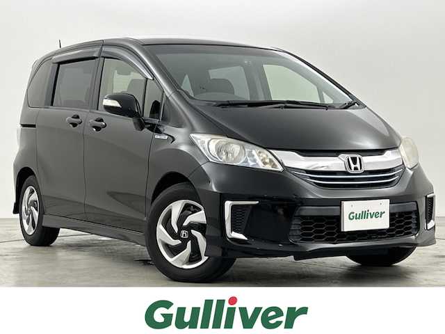 ホンダ フリード ハイブリット ジャストセレクション 福岡県 2014(平26)年 10.3万km プレミアムスパークルブラックパール フリップダウンモニター/純正ナビ/・CD/DVD/BT/フルセグ/バックカメラ/両側パワースライドドア/クルーズコントロール/ETC/ドライブレコーダー/キセノンライト/横滑り防止