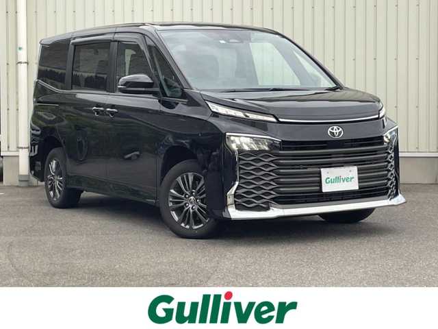 トヨタ ヴォクシー S－G 山形県 2022(令4)年 3.1万km グリッターブラックガラスフレーク 4WD/セーフティセンス/両側パワースライドドア/純正ナビ/　【BT USB Miracast Apps】/バックカメラ/ETC/前後ドライブレコーダー/ステアリングスイッチ/レーダークルーズコントロール/シートヒーター/オートホールド/横滑り防止装置/LEDライト/ウィンカーミラー/純正フロアマット/ドアバイザー/保証書、取説あり