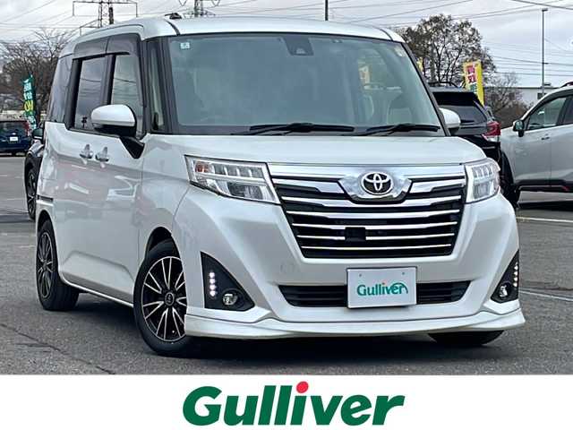 トヨタ ルーミー カスタムG－T 道央・札幌 2018(平30)年 6.6万km パールホワイトⅢ ４WD/純正ディーラーOPナビ/CD/DVD/BT/フルセグ/スマートアシスト/衝突被害軽減ブレーキ/横滑り防止装置/クルーズコントロール/レーンキープアシスト/リアコーナーセンサー/アラウンドビューモニター/ビルトインETC/ドライブレコーダー/アイドリングストップ/SPORTMODE/両側パワースライドドア/プッシュスタート/スマートキー/LEDヘッドライト/オートライト/フォグランプ/電動格納ミラー/ウィンカーミラー/純正フロアマット/ドアバイザー