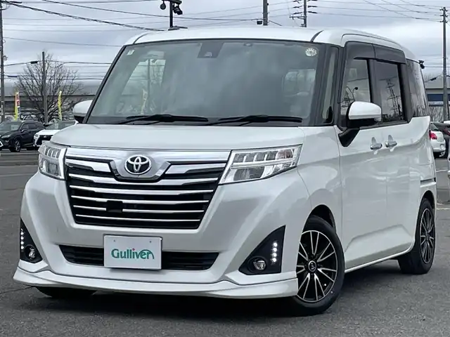 トヨタ ルーミー カスタムG－T 道央・札幌 2018(平30)年 6.6万km パールホワイトⅢ ４WD/純正ディーラーOPナビ/CD/DVD/BT/フルセグ/スマートアシスト/衝突被害軽減ブレーキ/横滑り防止装置/クルーズコントロール/レーンキープアシスト/リアコーナーセンサー/アラウンドビューモニター/ビルトインETC/ドライブレコーダー/アイドリングストップ/SPORTMODE/両側パワースライドドア/プッシュスタート/スマートキー/LEDヘッドライト/オートライト/フォグランプ/電動格納ミラー/ウィンカーミラー/純正フロアマット/ドアバイザー