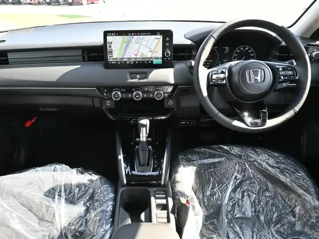 ホンダ ヴェゼル ハイブリッド e:HEV Z 千葉県 2025(令7)年 0.1千km クリスタルブラックパール e:HEV Z　4VC4AZ　Honda CONNECTディスプレー+ETC2.0車載器+ワイヤレス充電器(231000)/ホンダセンシング/・衝突軽減ブレーキ（CMBS）/・車線維持支援システム（LKAS）/・アダプティブクルーズコントロール（ACC）/・後方誤発進抑制機能/・誤発進抑制機能/パワーバックドア/ハーフレザーシート/前席シートヒーター/純正コネクトナビ/地デジTV/【Bluetooth接続】/【Apple CarPlay　Android Auto対応】/バックカメラ/ワイヤレス充電/革巻きステアリング/ステアリングヒーター/ステアリングスイッチ/パドルシフト/ETC（2.0）/LEDヘッドライト/フォグライト/ウインカーミラー/コーナーセンサー/純正18インチアルミホイル/サイド/カーテンエアバッグ/Honda スマートキー