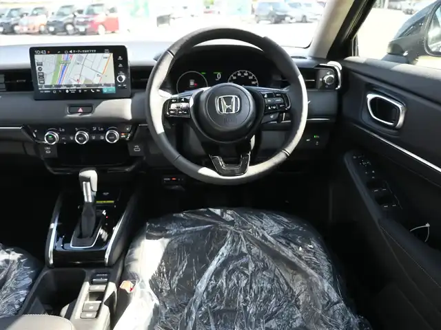 ホンダ ヴェゼル ハイブリッド e:HEV Z 千葉県 2025(令7)年 0.1千km クリスタルブラックパール e:HEV Z　4VC4AZ　Honda CONNECTディスプレー+ETC2.0車載器+ワイヤレス充電器(231000)/ホンダセンシング/・衝突軽減ブレーキ（CMBS）/・車線維持支援システム（LKAS）/・アダプティブクルーズコントロール（ACC）/・後方誤発進抑制機能/・誤発進抑制機能/パワーバックドア/ハーフレザーシート/前席シートヒーター/純正コネクトナビ/地デジTV/【Bluetooth接続】/【Apple CarPlay　Android Auto対応】/バックカメラ/ワイヤレス充電/革巻きステアリング/ステアリングヒーター/ステアリングスイッチ/パドルシフト/ETC（2.0）/LEDヘッドライト/フォグライト/ウインカーミラー/コーナーセンサー/純正18インチアルミホイル/サイド/カーテンエアバッグ/Honda スマートキー