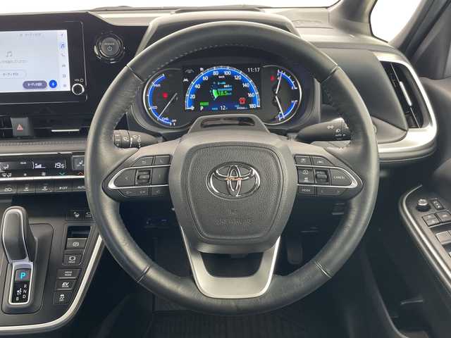 トヨタ ヴォクシー ハイブリッド S－Z 愛知県 2023(令5)年 3.5万km ホワイトパールクリスタルシャイン トヨタチームメイト/アドバンストパーク/アドバンストドライブ/純正ディズプレイオーディオナビ/フリップダウンモニター/両側パワースライドドア/レーダークルーズコントロール/シートヒーター/バックカメラ/ヘッドアップディスプレイ/コーナーセンサー/純正アルミホイール/ETC2.0/ブラインドスポットモニター/LEDヘッドライト/インテリジェントミラー/リアオートエアコン/オートマチックハイビーム/ドライブレコーダー/衝突軽減システム/Bluetooth/ステアリングスイッチ/スマートキー/プッシュスタート