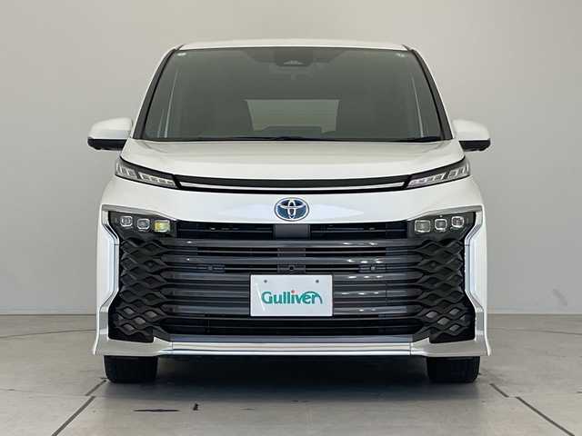 トヨタ ヴォクシー ハイブリッド S－Z 愛知県 2023(令5)年 3.5万km ホワイトパールクリスタルシャイン トヨタチームメイト/アドバンストパーク/アドバンストドライブ/純正ディズプレイオーディオナビ/フリップダウンモニター/両側パワースライドドア/レーダークルーズコントロール/シートヒーター/バックカメラ/ヘッドアップディスプレイ/コーナーセンサー/純正アルミホイール/ETC2.0/ブラインドスポットモニター/LEDヘッドライト/インテリジェントミラー/リアオートエアコン/オートマチックハイビーム/ドライブレコーダー/衝突軽減システム/Bluetooth/ステアリングスイッチ/スマートキー/プッシュスタート