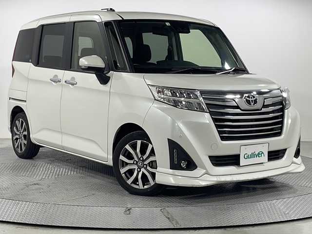 トヨタ ルーミー 広島県 2020(令2)年 5.6万km パール 禁煙車/社外9インチナビ（AVIC-RQ903）/クルーズコントロール/スマートアシスト/両側パワースライドドア/スマートキー/クリアランスソナー/レーンキープ/オートマチックハイビーム/純正15インチアルミホイール/純正フロアマット/LEDヘッドライト/スペアキー/ETC