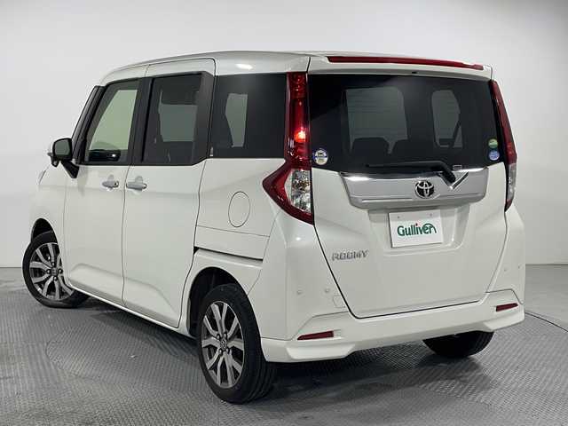 トヨタ ルーミー 広島県 2020(令2)年 5.6万km パール 禁煙車/社外9インチナビ（AVIC-RQ903）/クルーズコントロール/スマートアシスト/両側パワースライドドア/スマートキー/クリアランスソナー/レーンキープ/オートマチックハイビーム/純正15インチアルミホイール/純正フロアマット/LEDヘッドライト/スペアキー/ETC