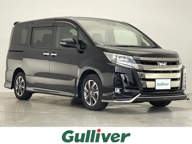 トヨタ ノア Si ダブルバイビーⅡ 滋賀県 2020(令2)年 6.5万km ブラック モデリスタエアロ(フロント、リア)/純正９インチナビ(CD/DVD/フルセグ/Bluetooth)/後席モニター/ＥＴＣ/両側電動ドア/ハーフレザーシート/LEDライト/オートライト/オートハイビーム/クリアランスソナー/クルーズコントロール/レーンキープアシスト/横滑り防止装置/衝突軽減システム/プッシュスタート/スマートキー×2