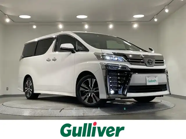 トヨタ ヴェルファイア Z Gエディション 愛知県 2020(令2)年 5.4万km ホワイトパールクリスタルシャイン 純正10インチナビ/（Bluetooth/AM/FM/フルセグTV）/サンルーフ/フリップダウンモニター/衝突軽減ブレーキ/両側電動スライドドア/レーダークルーズコントロール/シートヒーター/エアシート/LEDヘッドライト/ETC/バックカメラ/ステアリングヒーター/パワーシート/電動リアゲート/コーナーセンサー/スマートキー/純正18インチAW