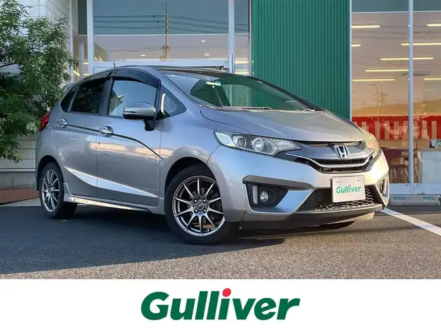 ホンダ フィット 13G Sパッケージ 岡山県 2014(平26)年 5.6万km ティンテッドシルバーM ベーシックインターナビ/フルセグテレビ/Bluetooth/iPod/AUX/USB接続可能/パドルシフト/ECOモード/アイドリングストップ/ETC/バックカメラ/プッシュスタート/LEDヘッドライト/純正フロアマット/社外アルミホイール