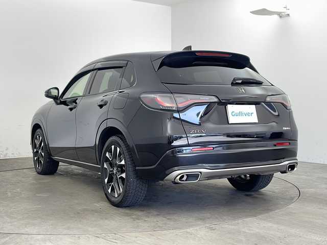 ホンダ ＺＲ－Ｖ ハイブリッド e:HEV Z 兵庫県 2024(令6)年 2.8万km クリスタルブラックパール ・Honda SENSING/・衝突軽減ブレーキ/・先行車発進お知らせ機能/・歩行者事故低減ステアリング/・路外逸脱抑制機能/・標識認識機能/・渋滞追従機能付アダプティブクルーズコントロール/・車線維持支援システム/・トラフィックジャムアシスト（渋滞運転支援機能）/・ブラインドスポットインフォメーション/・誤発進抑制機能/・後方誤発進抑制機能/・近距離衝突軽減ブレーキ/・パーキングセンサーシステム/・後退出庫サポート/・オートハイビーム/・アダプティブドライビングビーム/・BOSEプレミアムサウンドシステム/・純正9インチナビ＆フルセグ＆BT＆USB＆AppleCarPlay/・マルチビューカメラシステム/・ハンズフリーアクセスパワーテールゲート/・本革シート/・前席シートヒーター/・前席パワーシート/・運転席メモリーシート/・革巻きステアリング/・ステアリングリモコン/・ステアリングヒーター/・ワイヤレス充電/・ビルトインETC2.0/・パドルシフト/・横滑り防止装置/・純正フロアマット/・前席ゴムマットあり/・純正18インチアルミホイール/・LEDヘッドライト/・フォグ/・ドアバイザー