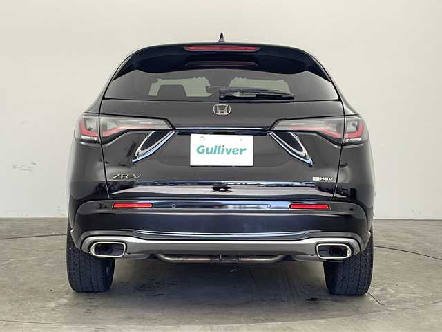 ホンダ ＺＲ－Ｖ ハイブリッド e:HEV Z 兵庫県 2024(令6)年 2.8万km クリスタルブラックパール ・Honda SENSING/・衝突軽減ブレーキ/・先行車発進お知らせ機能/・歩行者事故低減ステアリング/・路外逸脱抑制機能/・標識認識機能/・渋滞追従機能付アダプティブクルーズコントロール/・車線維持支援システム/・トラフィックジャムアシスト（渋滞運転支援機能）/・ブラインドスポットインフォメーション/・誤発進抑制機能/・後方誤発進抑制機能/・近距離衝突軽減ブレーキ/・パーキングセンサーシステム/・後退出庫サポート/・オートハイビーム/・アダプティブドライビングビーム/・BOSEプレミアムサウンドシステム/・純正9インチナビ＆フルセグ＆BT＆USB＆AppleCarPlay/・マルチビューカメラシステム/・ハンズフリーアクセスパワーテールゲート/・本革シート/・前席シートヒーター/・前席パワーシート/・運転席メモリーシート/・革巻きステアリング/・ステアリングリモコン/・ステアリングヒーター/・ワイヤレス充電/・ビルトインETC2.0/・パドルシフト/・横滑り防止装置/・純正フロアマット/・前席ゴムマットあり/・純正18インチアルミホイール/・LEDヘッドライト/・フォグ/・ドアバイザー