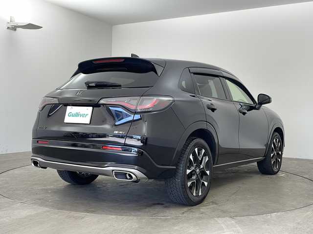 ホンダ ＺＲ－Ｖ ハイブリッド e:HEV Z 兵庫県 2024(令6)年 2.8万km クリスタルブラックパール ・Honda SENSING/・衝突軽減ブレーキ/・先行車発進お知らせ機能/・歩行者事故低減ステアリング/・路外逸脱抑制機能/・標識認識機能/・渋滞追従機能付アダプティブクルーズコントロール/・車線維持支援システム/・トラフィックジャムアシスト（渋滞運転支援機能）/・ブラインドスポットインフォメーション/・誤発進抑制機能/・後方誤発進抑制機能/・近距離衝突軽減ブレーキ/・パーキングセンサーシステム/・後退出庫サポート/・オートハイビーム/・アダプティブドライビングビーム/・BOSEプレミアムサウンドシステム/・純正9インチナビ＆フルセグ＆BT＆USB＆AppleCarPlay/・マルチビューカメラシステム/・ハンズフリーアクセスパワーテールゲート/・本革シート/・前席シートヒーター/・前席パワーシート/・運転席メモリーシート/・革巻きステアリング/・ステアリングリモコン/・ステアリングヒーター/・ワイヤレス充電/・ビルトインETC2.0/・パドルシフト/・横滑り防止装置/・純正フロアマット/・前席ゴムマットあり/・純正18インチアルミホイール/・LEDヘッドライト/・フォグ/・ドアバイザー