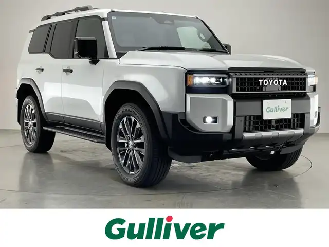 トヨタ ランドクルーザー ２５０ ZX 愛知県 2024(令6)年 0.4万km プラチナホワイトパールマイカ 純正１２．３型ナビ　Ｇｒｇｏセキュリティ　ムーンルーフ　ＪＢＬ　デジイン　茶革　全方位カメラ　ヒッチメンバー　ＥＴＣ２．０　ベンチレーション　ＢＳＭ　ワイヤレス充電　ＨＤＭＩ　トヨタチームメイト　禁煙　モデリスタ