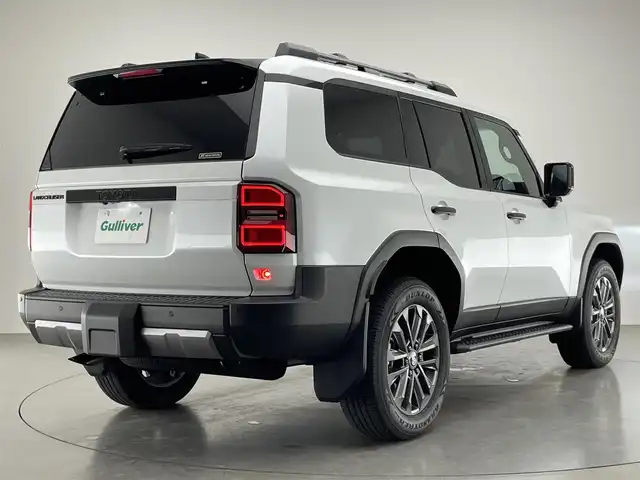 トヨタ ランドクルーザー ２５０ ZX 愛知県 2024(令6)年 0.4万km プラチナホワイトパールマイカ 純正１２．３型ナビ　Ｇｒｇｏセキュリティ　ムーンルーフ　ＪＢＬ　デジイン　茶革　全方位カメラ　ヒッチメンバー　ＥＴＣ２．０　ベンチレーション　ＢＳＭ　ワイヤレス充電　ＨＤＭＩ　トヨタチームメイト　禁煙　モデリスタ