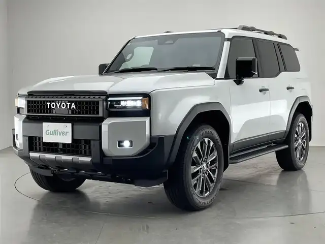 トヨタ ランドクルーザー ２５０ ZX 愛知県 2024(令6)年 0.4万km プラチナホワイトパールマイカ 純正１２．３型ナビ　Ｇｒｇｏセキュリティ　ムーンルーフ　ＪＢＬ　デジイン　茶革　全方位カメラ　ヒッチメンバー　ＥＴＣ２．０　ベンチレーション　ＢＳＭ　ワイヤレス充電　ＨＤＭＩ　トヨタチームメイト　禁煙　モデリスタ