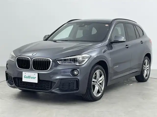 ＢＭＷ Ｘ１ xDrive 18d Mスポーツ 大分県 2016(平28)年 9.8万km グレー メーカーナビ/DVD/Bluetooth/バックカメラ/コーナーセンサー/オートLEDライト/前方ドライブレコーダー/衝突軽減ブレーキ/純正18インチAW/純正フロアマット/スマートキーX2/保証書/取扱説明書