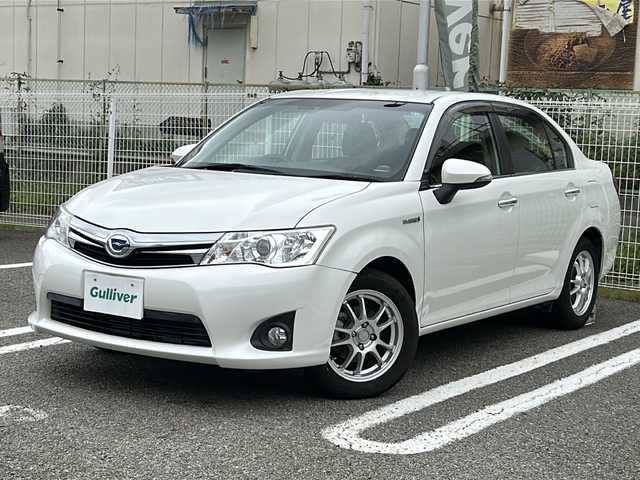 トヨタ カローラ アクシオ ハイブリッドG 兵庫県 2014(平26)年 5.3万km ホワイトパールクリスタルシャイン 純正ナビ/フルセグTV/Bluetooth/バックカメラ/OP/・前席シートヒーター/・スマートエントリー/スタートシステム/・HIDヘッドランプ/オートライト/ＥＴＣ/ドライブレコーダー/取扱説明書・保証書・スペアキー