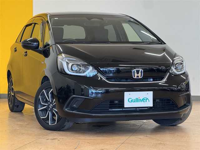 ホンダ フィット e:HEVホーム 群馬県 2020(令2)年 7.7万km クリスタルブラックパール ホンダセンシング/純正8インチSDナビ/　　CD/DVD/BT/フルセグ/USB/iPod/バックカメラ/レーダークルーズコントロール/LEDオートライト/オートハイビーム/ハーフレザーシート/純正16インチAW/コーナーセンサー/前後ドライブレコーダー/レーンアシスト/オートブレーキホールド/ステアリングスイッチ/横滑り防止装置/サイド・カーテンエアバッグ/スマートキー/ビルトインETC