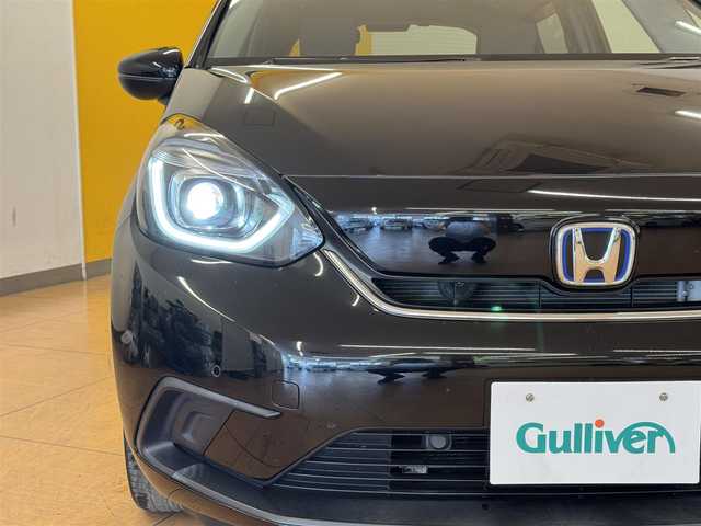 ホンダ フィット e:HEVホーム 群馬県 2020(令2)年 7.7万km クリスタルブラックパール ホンダセンシング/純正8インチSDナビ/　　CD/DVD/BT/フルセグ/USB/iPod/バックカメラ/レーダークルーズコントロール/LEDオートライト/オートハイビーム/ハーフレザーシート/純正16インチAW/コーナーセンサー/前後ドライブレコーダー/レーンアシスト/オートブレーキホールド/ステアリングスイッチ/横滑り防止装置/サイド・カーテンエアバッグ/スマートキー/ビルトインETC