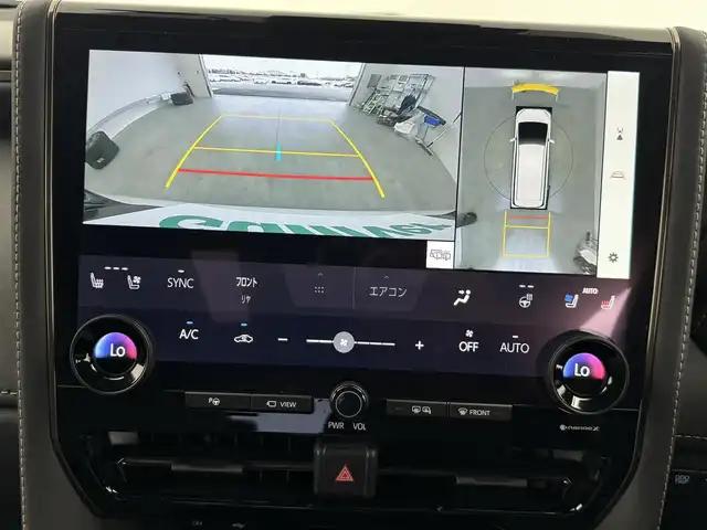 トヨタ ヴェルファイア ハイブリット Z プレミア 愛知県 2024(令6)年 2万km プラチナホワイトパールマイカ 13.2型有機EL後席ディスプレイ/左右独立ムーンルーフ　/純正14型メモリナビ/（FM/AM/BT/フルセグTV）　/全方位バックカメラ　/合皮シート　/前席＋二席目シートベンチレーション/前席＋二席目シートヒーター　/前席＋二席目パワーシート/ステアリングヒーター　/置くだけ充電　/デジタルインナーミラー　/ETC2.0/電動リアゲート/トヨタセーフティセンス/・プリクラッシュセーフティ/・レーンキープアシスト/・ブラインドスポットモニター/・ヘッドアップディスプレイ/・クリアランスソナー/・パーキングサポートブレーキ/・ロードサインアシスト/・レーダークルーズコントロール/・アダクティブハイビームシステム/・両側パワースライドドア/・純正19インチAW/・純正LEDヘッドライト/・純正フロアマット