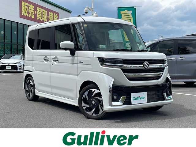 スズキ スペーシア カスタム HYBRID XS ターボ 長野県 2023(令5)年 0.6万km ピュアホワイトP 純正9インチメモリナビ/AppleCarPlay対応/Bluetooth Audio/フルセグテレビ/全方位カメラ・バックカメラ/レーダークルーズコントロール/純正15インチアルミホイール/両側パワースライドドア/ヘッドアップディスプレイ/前後コーナーセンサー/衝突被害軽減ブレーキ/ステアリングヒーター/ハーフレザーシート/前席シートヒーター/アイドリングストップ/ステアリングスイッチ/パドルシフト/LEDヘッドライト/オートハイビーム/オートライト/フォグランプ/純正フロアマット/プッシュスタート/スマートキー/スペアキー/取扱説明書/保証書