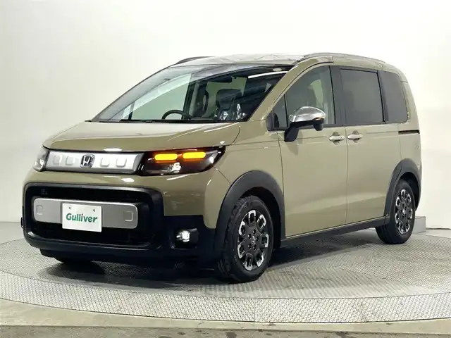 ホンダ フリード ハイブリット e:HEV クロスター 大阪府 2025(令7)年 0.1千km ベージュ 未使用車　ハーフレザー　純正ナビＴＶ　両側パワスラ　シートヒーター　バックカメラ　レーダークルコン　衝突軽減　レーンアシスト　クリアランスソナー　オートハイビーム　ＬＥＤヘッドライト　ＢＳＭ　禁煙車