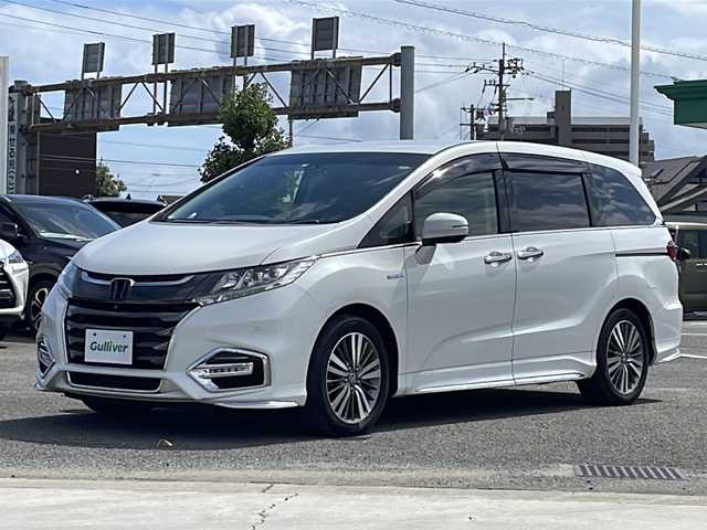 ホンダ オデッセイ ハイブリッド アブソルート・EXホンダセンジング 徳島県 2018(平30)年 8.4万km プラチナホワイトパール 純正9型ナビ　VXM-187VFNi/（SD/フルセグ/DISC/USB/iPod/BT/ラジオ）/バックカメラ/全方位カメラ/フリップダウンモニター/ハーフレザーシート/ビルトインETC2.0/追従式クルーズコントロール/ブラインドスポットモニター/D/N席パワーシート/両側電動スライドドア/リヤオートエアコン/D/N席シートヒーター/オートブレーキホールド/ドアバイザー/フォグライト/純正フロアマット/LEDヘッドライト