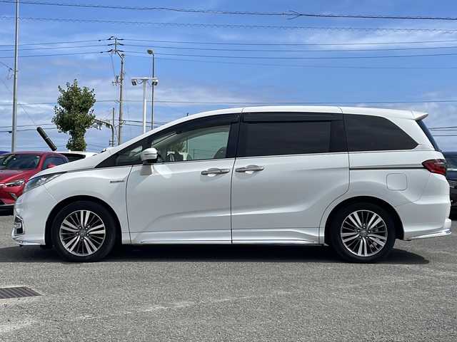 ホンダ オデッセイ ハイブリッド アブソルート・EXホンダセンジング 徳島県 2018(平30)年 8.4万km プラチナホワイトパール 純正9型ナビ　VXM-187VFNi/（SD/フルセグ/DISC/USB/iPod/BT/ラジオ）/バックカメラ/全方位カメラ/フリップダウンモニター/ハーフレザーシート/ビルトインETC2.0/追従式クルーズコントロール/ブラインドスポットモニター/D/N席パワーシート/両側電動スライドドア/リヤオートエアコン/D/N席シートヒーター/オートブレーキホールド/ドアバイザー/フォグライト/純正フロアマット/LEDヘッドライト