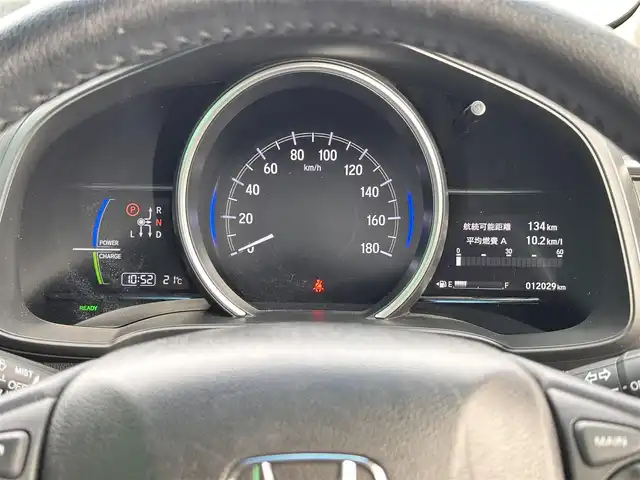ホンダ フィット ハイブリット L ホンダセンシング 宮城県 2018(平30)年 1.2万km ルージュアメジストM ホンダセンシング/衝突軽減ブレーキ〈CMBS〉/●誤発進抑制機能/●歩行者事故低減ステアリング/●路外逸脱抑制機能/●ACC〈アダプティブ・クルーズ・コントロール〉/●LKAS〈車線維持支援システム〉/●先行車発進お知らせ機能/●標識認識機能/コンフォートビューパッケージ/●親水/ヒーテッドドアミラー/●フロントドア撥水ガラス/●熱線入りフロントウインドウ/純正ナビ（VXM-184VFi）/・CD/DVD/・Bluetooth/・フルセグTV/バックカメラ/ビルトインETC/ドライブレコーダー/ハーフレザーシート/革巻きステアリング/ステアリングスイッチ/LEDヘッドランプ/LEDフォグランプ/オートライト/スマートキー＆プッシュスタート/スペアキー1本/電動格納ミラー/純正フロアマット/ドアバイザー/W/サイド/カーテンエアバッ