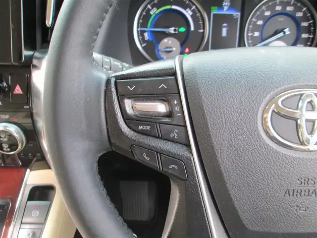 トヨタ ヴェルファイア ハイブリット V Lエディション 道央・札幌 2015(平27)年 3.9万km ホワイトパールクリスタルシャイン ワンオーナー/モデリスタエアロ/メーカーナビ、フルセグTV/JBLサウンドシステム/パノラミックビューモニター/リアエンターテイメントシステム/プリクラッシュセーフティ/ベージュレザーシート/前席パワーシート/シートヒーター/セカンドセミパワーシート/パワーバックドア/LEDヘッドライト&LEDフォグ/純正17インチアルミホイール/ウッドコンビハンドル/ステアリングヒーター/前後ドライブレコーダー/ビルトインETC/新車整備手帳/取扱説明書/スペアキー