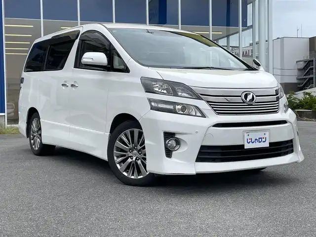 トヨタ ヴェルファイア 2．4Z ゴールデンアイズⅡ 福島県 2014(平26)年 12.2万km ホワイトパールクリスタルシャイン (株)IDOMが運営する【じしゃロンいわき店】の自社ローン専用車両になります。こちらは現金またはオートローンご利用時の価格です。自社ローンご希望の方は別途その旨お申付け下さい/登録時走行距離121761km/ALPINE社外ナビゲーション/型番：EX1000/フリップダウンモニター /バックカメラ/プッシュスタート/スマートキー/両側パワースライドドア/パワーバックドア/純正サイドバイザー/純正フロアマット/１２V電源/クルーズコントロール/純正アルミホイール