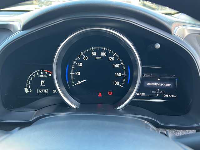 ホンダ フィット 13G F コンフォートED 長野県 2018(平30)年 0.6万km ルージュアメジストM ・純正7インチSDナビゲーション/CD ワンセグTV Bluetooth/・バックカメラ/・ビルトインETC/・ホンダセンシング/・レーンキープアシスト/・レーダークルーズコントロール/・アイドリングストップ/・横滑り防止装置/・ウィンカーミラー/・電動格納ミラー/・スマートキー/・エンジンプッシュスタート