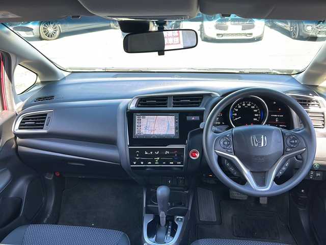 ホンダ フィット 13G F コンフォートED 長野県 2018(平30)年 0.6万km ルージュアメジストM ・純正7インチSDナビゲーション/CD ワンセグTV Bluetooth/・バックカメラ/・ビルトインETC/・ホンダセンシング/・レーンキープアシスト/・レーダークルーズコントロール/・アイドリングストップ/・横滑り防止装置/・ウィンカーミラー/・電動格納ミラー/・スマートキー/・エンジンプッシュスタート