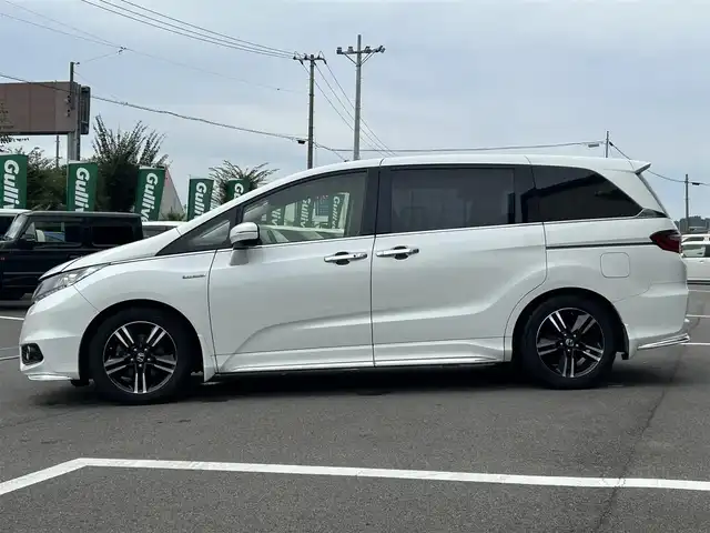 ホンダ オデッセイ ハイブリッド アブソルートセンシングEXパック 愛媛県 2017(平29)年 6.1万km ホワイトオーキッドパール アルパイン9型ナビ/アルパイン11型後席モニター(パッケージ-M1100)/両側電動スライド/アダプティブクルーズコントロール/ブラインドスポットモニター/クリアランスソナー/衝突被害軽減装置/車線逸脱防止装置/先進車発進お知らせ/電格ミラー/ヒートミラー/LEDヘッドライト/後付け大型アームレスト/無限ドアハンドルプロテクター/100V充電コンセント/現状サマー(純正AW)(215/55/R17)/YOKOHAMA iCeGUARD iG60