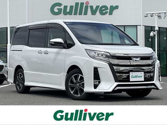 トヨタ ノア Si ダブルバイビーⅡ 佐賀県 2020(令2)年 4.5万km ホワイトパールクリスタルシャイン 純正9インチSDナビゲーション/・フルセグTV/CD/DVD/SD/Bluetooth/純正フリップダウンモニター/バックカメラ/前後ドライブレコーダー/ETC/両側パワースライドドア/後席エアコン/ハーフレザーシート/キャプテンシート/後席サンシェード/ISOFIX対応/革巻きステアリング/ステアリングリモコン/純正16インチアルミホイール/純正LEDヘッドライト/・オートマチックハイビーム/純正LEDフォグランプ/純正フロアマット/純正ドアバイザ―/取扱説明書/トヨタセーフティセンス/・クルーズコントロール/・レーンディパーチャーアラート/・プリクラッシュセーフティ/・クリアランスソナー