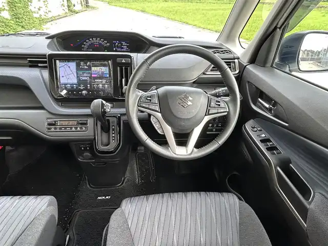 スズキ ソリオ HV SZ 長崎県 2023(令5)年 2.7万km ピュアホワイトパール/ガンメタリック2トーン 純正9インチナビ/（Bluetooth/フルセグ）/全方位カメラ/衝突軽減システム/レーンアシスト/レーダークルーズ/ETC/両側パワースライドドア/ヘッドアップディスプレイ/パドルシフト/前後ドライブレコーダー/バックソナー/純正15インチAW