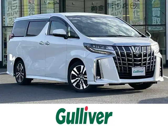 トヨタ アルファード S Cパッケージ 岡山県 2019(令1)年 8.3万km ホワイトパールクリスタルシャイン 登録時走行距離82138km/ALPINE11インチナビ/フルセグTV(AM/FM/CD/DVD/Bluetooth)/ALPINE12.8インチフリップダウンモニター/バックカメラ/両側パワースライドドア/ビルトインETC/ドライブレコーダー/パワーバックドア/トヨタセーフティセンス/・プリクラッシュセーフティ/・レーダークルーズコントロール/・オートマチックハイビーム/・レーンディバーチャーアラート/オートブレーキホールド/横滑り防止装置/本革シート/D/N席シートヒーター/D/N席ベンチレーション/ステアリングヒーター/オットマン/18インチ純正AW/純正フロアマット