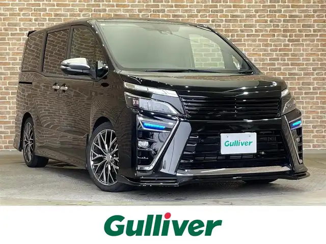 トヨタ ヴォクシー ZS 煌Ⅲ 岩手県 2021(令3)年 5.4万km イナズマスパーキングブラックガラスフレーク ４WD/寒冷地仕様/SILKBlazeエアロ・フロントグリル/モデリスタリヤスポイラー/TEIN車高調　FLEXZ/ALPINEビッグX11インチナビ/（CD/DVD/フルセグ/USB/Bluetooth）/ALPINEサブウーファー/両側パワースライドドア/トヨタセーフティセンスC/プリクラッシュセーフティ/レーンディパーチャーアラート/オートマチックハイビーム/クリアランスソナー/パーキングサポートブレーキ/横滑り防止装置/クルーズコントロール/リヤオートエアコン/ETC/バックカメラ/LEDヘッドライト/社外18インチアルミホイール