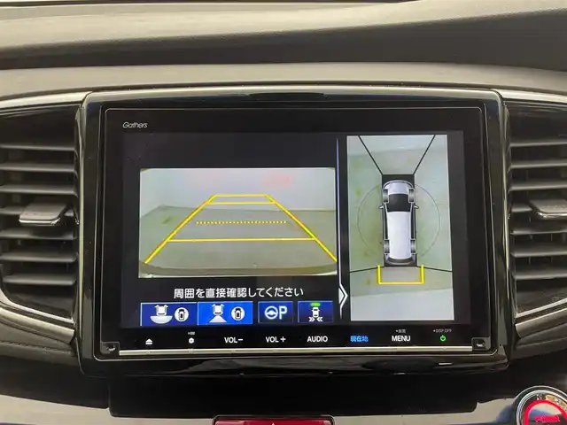 ホンダ オデッセイ ハイブリッド アブソルート・EXホンダセンジング 群馬県 2020(令2)年 2.4万km プレミアムヴィーナスブラックP 純正9インチHondaインターナビ/（フルセグＴＶ/BT/CD/DVD/AM/FM）/ビルトインETC2.0/===============/マルチビューカメラシステム/スマートパーキングアシスト/両側パワースライドドア/前席シートヒーター/前席パワーシート/後退出庫サポート/ブラインドスポットモニター/ホンダセンシング/・衝突軽減ブレーキ〈CMBS〉/・誤発進抑制機能/・歩行者事故低減ステアリング/・路外逸脱抑制機能/・渋滞追従機能付ACC〈アダプティブ・クルーズ・コントロール〉/・LKAS〈車線維持支援システム〉/・先行車発進お知らせ機能/・標識認識機能/AC100V電源/デジタルミラー型ドライブレコーダー/大型アームレスト・センターコンソール