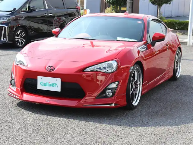 トヨタ ８６ GT リミテッド 神奈川県 2012(平24)年 5.7万km ライトニングレッド モデリスタエアロ（F・S・R）/TOM’S4本出しマフラー/：TOM’S4スモークテールレンズ/車高調/社外メモリナビ/Bluetoothオーディオ/バックカメラ/プッシュスタート/ドライブレコーダー（前後）/社外シルバーメッキ19インチアルミホイール/：235/35R19/ハーフレザーシート/：シートヒーター/フロアマット