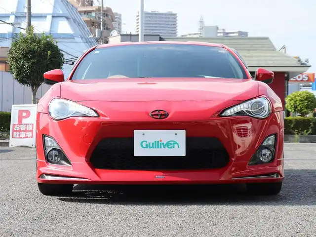 トヨタ ８６ GT リミテッド 神奈川県 2012(平24)年 5.7万km ライトニングレッド モデリスタエアロ（F・S・R）/TOM’S4本出しマフラー/：TOM’S4スモークテールレンズ/車高調/社外メモリナビ/Bluetoothオーディオ/バックカメラ/プッシュスタート/ドライブレコーダー（前後）/社外シルバーメッキ19インチアルミホイール/：235/35R19/ハーフレザーシート/：シートヒーター/フロアマット