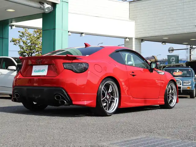 トヨタ ８６ GT リミテッド 神奈川県 2012(平24)年 5.7万km ライトニングレッド モデリスタエアロ（F・S・R）/TOM’S4本出しマフラー/：TOM’S4スモークテールレンズ/車高調/社外メモリナビ/Bluetoothオーディオ/バックカメラ/プッシュスタート/ドライブレコーダー（前後）/社外シルバーメッキ19インチアルミホイール/：235/35R19/ハーフレザーシート/：シートヒーター/フロアマット