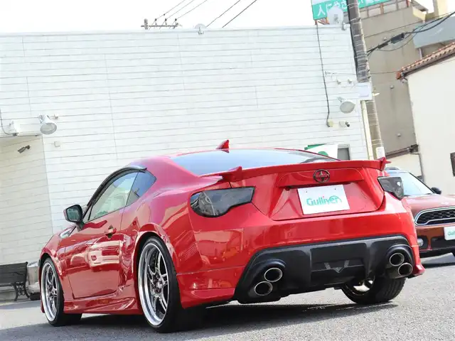 トヨタ ８６ GT リミテッド 神奈川県 2012(平24)年 5.7万km ライトニングレッド モデリスタエアロ（F・S・R）/TOM’S4本出しマフラー/：TOM’S4スモークテールレンズ/車高調/社外メモリナビ/Bluetoothオーディオ/バックカメラ/プッシュスタート/ドライブレコーダー（前後）/社外シルバーメッキ19インチアルミホイール/：235/35R19/ハーフレザーシート/：シートヒーター/フロアマット
